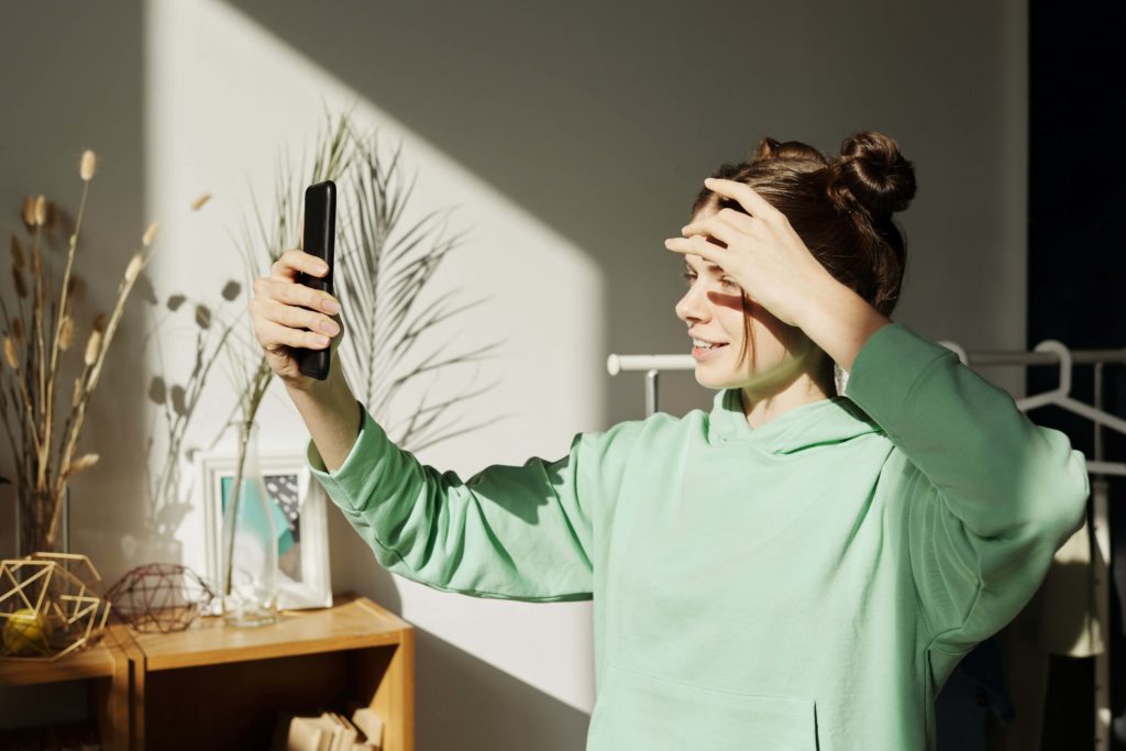 Woman brand ambassador filming a video for social media